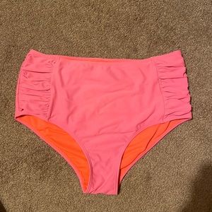 Hot pink swim bottoms with full coverage and ruching.